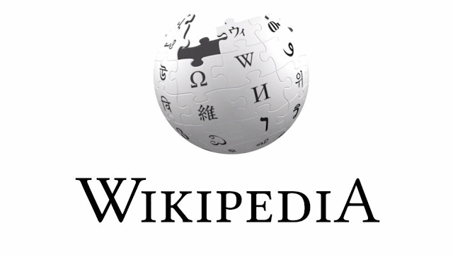 Esfera cinzenta composta por peças de puzzle com caracteres de vários alfabetos, representando o logótipo da Wikipedia, a enciclopédia online colaborativa.